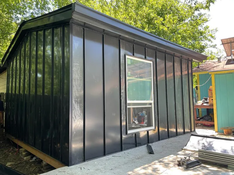 Black standing seam metal wall panels for Roof Inspection in Federal Heights